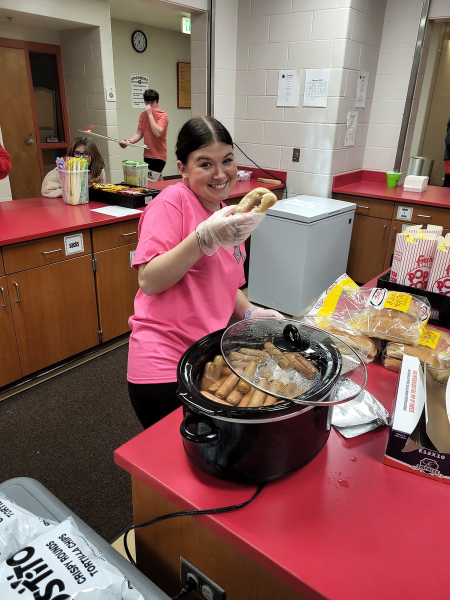 HHCU volunteer serves food during a Mitchell cancer benefit